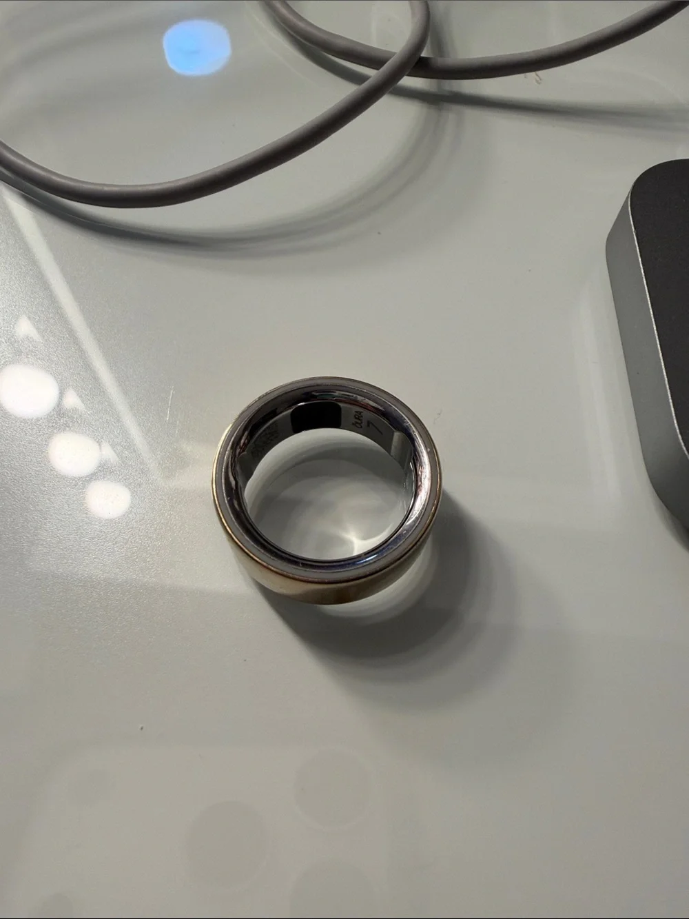 Oura Ring series 4. Size 7. Charging Dock and Cable included.